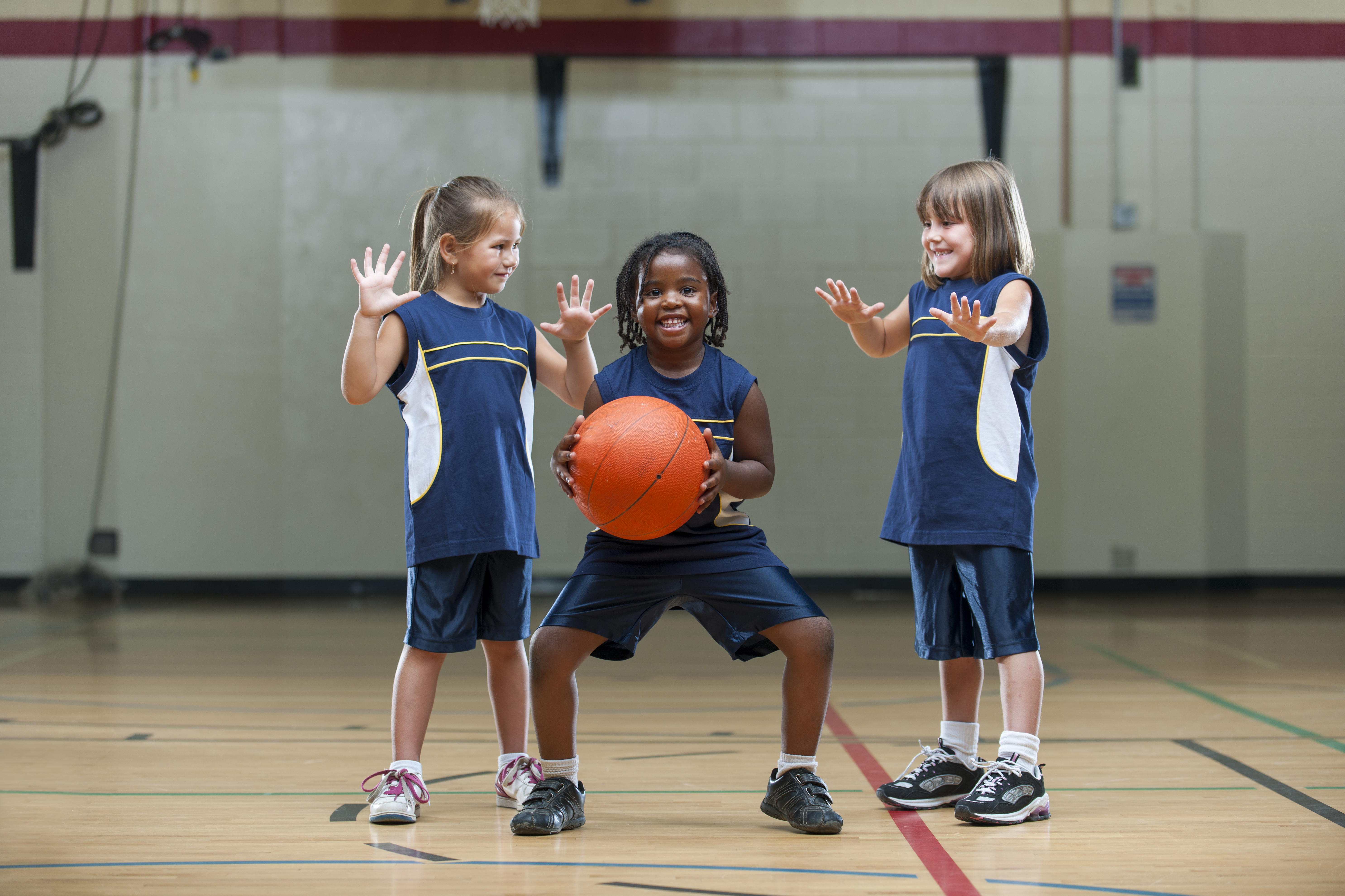 Kids playing basketball.