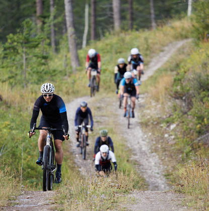 A group of men compete in the 2024 TransRockies Gravel Royale bike race in British Columbia, Canada. The Gravel Royale is a three-day stage race based out of Nipika Mountain Resort near Radium, British Columbia, Canada. The course takes the racers over a combination of gravel forestry and mining roads. (John Gibson Photo / GibsonPictures)
