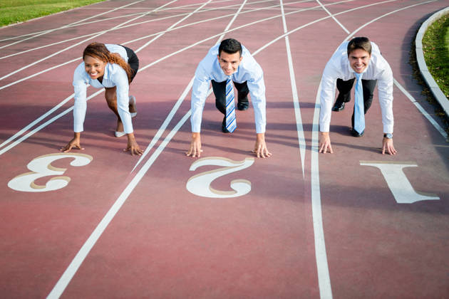 Group of competitive business people racing