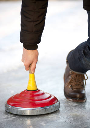 curling on ice outside
