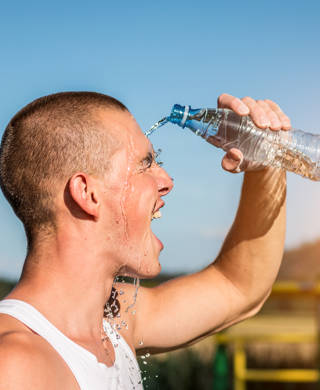 Male Athlete Cooling Off With Water, fast shutter speed used to capture every single water drop.http://shrani.si/f/2p/wI/3dJRJxvZ/resize.jpg