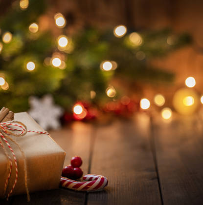 Brown Christmas gift box on rustic wooden table. High resolution 42Mp studio digital capture taken with Sony A7rII and Canon EF 70-200mm f/2.8L IS II USM Telephoto Zoom Lens