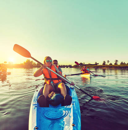 Kayaking and canoeing with family. Children on canoe. Family on kayak ride.