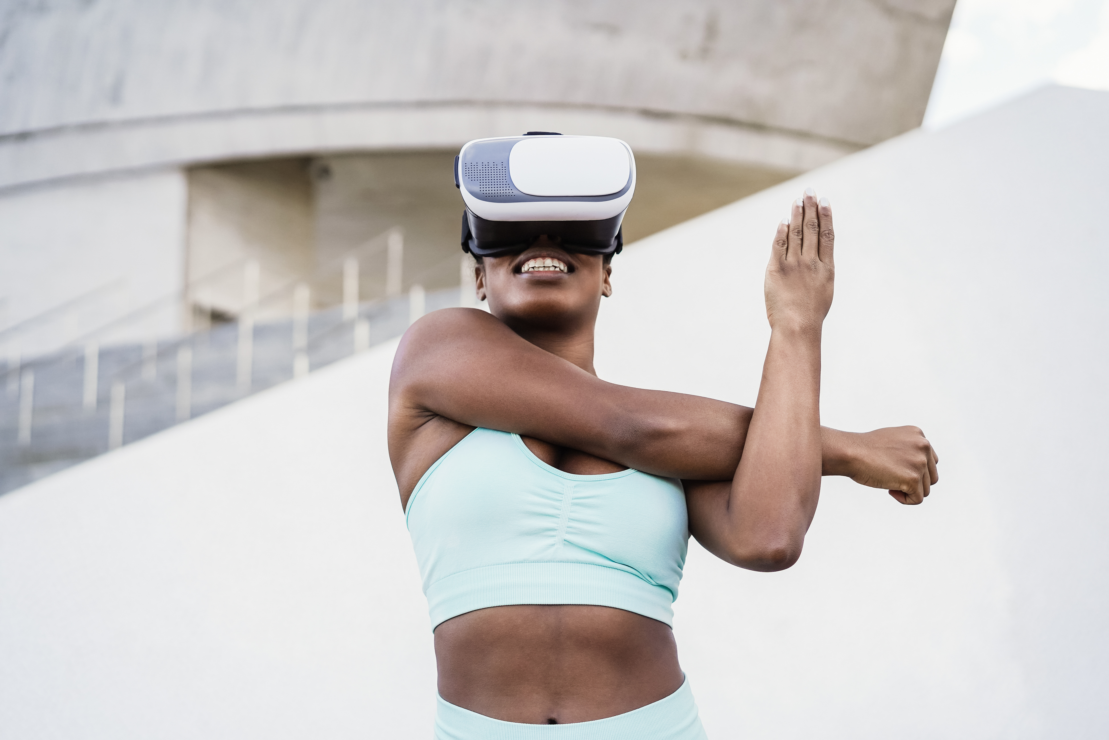 Fir african woman wearing virtual reality headset during sport workout routine - Focus on vr goggles