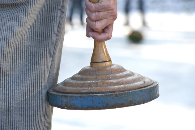curling on ice outside