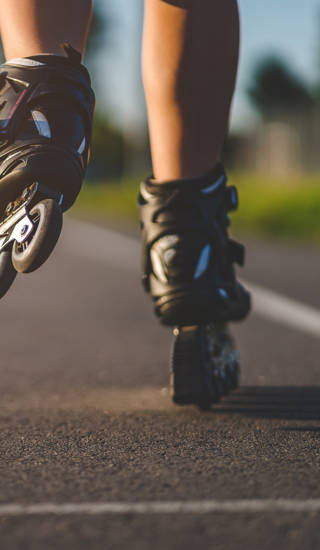 Roller skates during inline skating outdoors. Active lifestyle. Rollerblading
