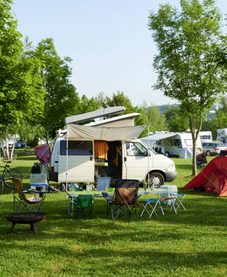 Away from Corona holiday with the rented caravan motorhome on campsite holiday