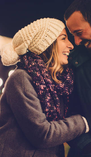 Romantic couple sharing their affection on Valentine's day, while walking outdoors