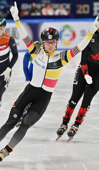 Belgium’s Hanne Desmet (C) celebrates her victory in the women’s 1000 meters final at the ISU World Short Track Championships in Beijing on March 15, 2025. (Photo by ADEK BERRY / AFP)