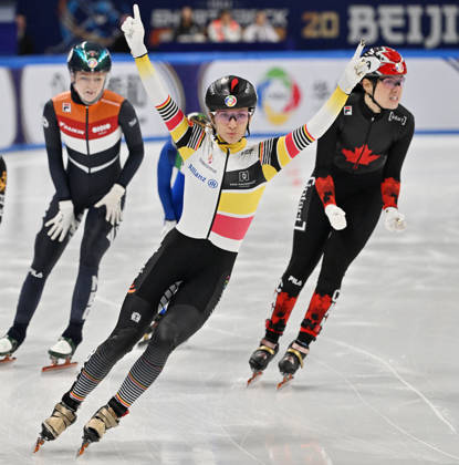 Belgium’s Hanne Desmet (C) celebrates her victory in the women’s 1000 meters final at the ISU World Short Track Championships in Beijing on March 15, 2025. (Photo by ADEK BERRY / AFP)