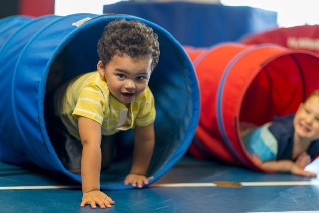 Diverse group of toddlers playing together.