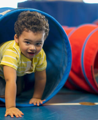 Diverse group of toddlers playing together.
