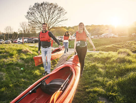 Cropped shot of a group of diverse colleagues canoeing as part of their company's team building retreat