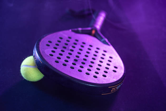 Padel tennis rackets. Sport court and balls. Download a high quality photo with paddle for the design of a sports app or social media advertisement