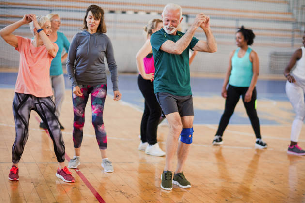 Energetic seniors people dancing at dance class