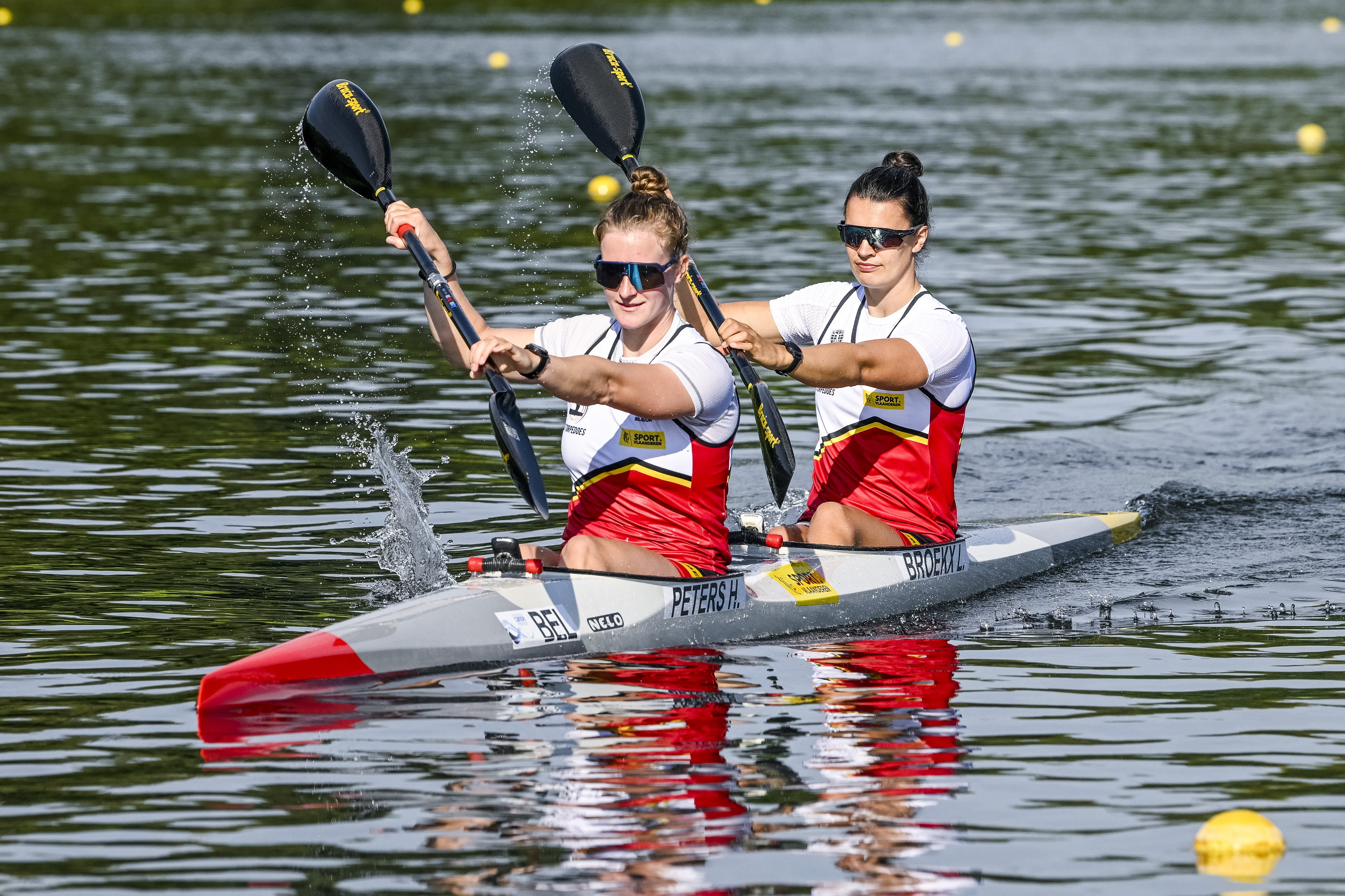 Red Torpedoes' kayaker Lize Broekx and Red Torpedoes' kayaker Hermien Peters pictured in action during a training session ahead of a press conference organized by the Vlaamse Roeiliga and Peddelsport Vlaanderen, ahead of the Olympic Games in Parijs 2024, Friday 11 August 2023 in Willebroek. During this press conference, the selection criteria and the athletes towards the Paris Olympics will be presented. BELGA PHOTO TOM GOYVAERTS