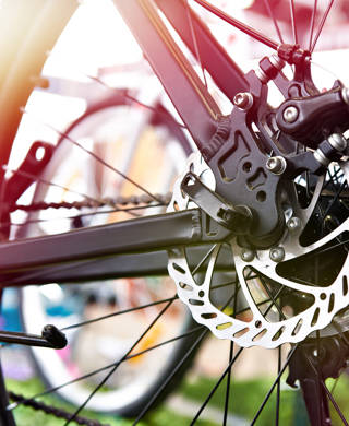 Brake disk of rear wheel sport mountain bike in shop