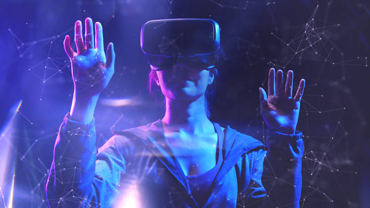 Teenager having fun play VR virtual reality glasses sport game 3D cyber space futuristic neon colorful background, future digital technology game and entertainment