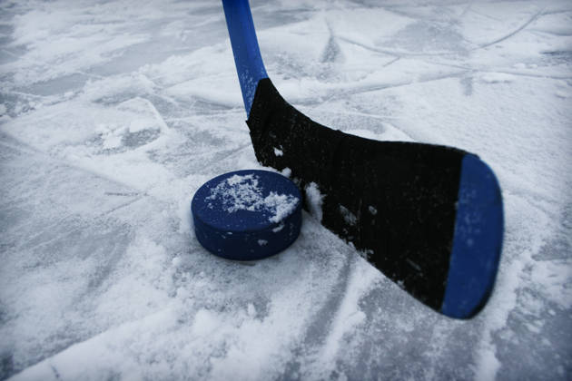 Icehockey stick and a puck.