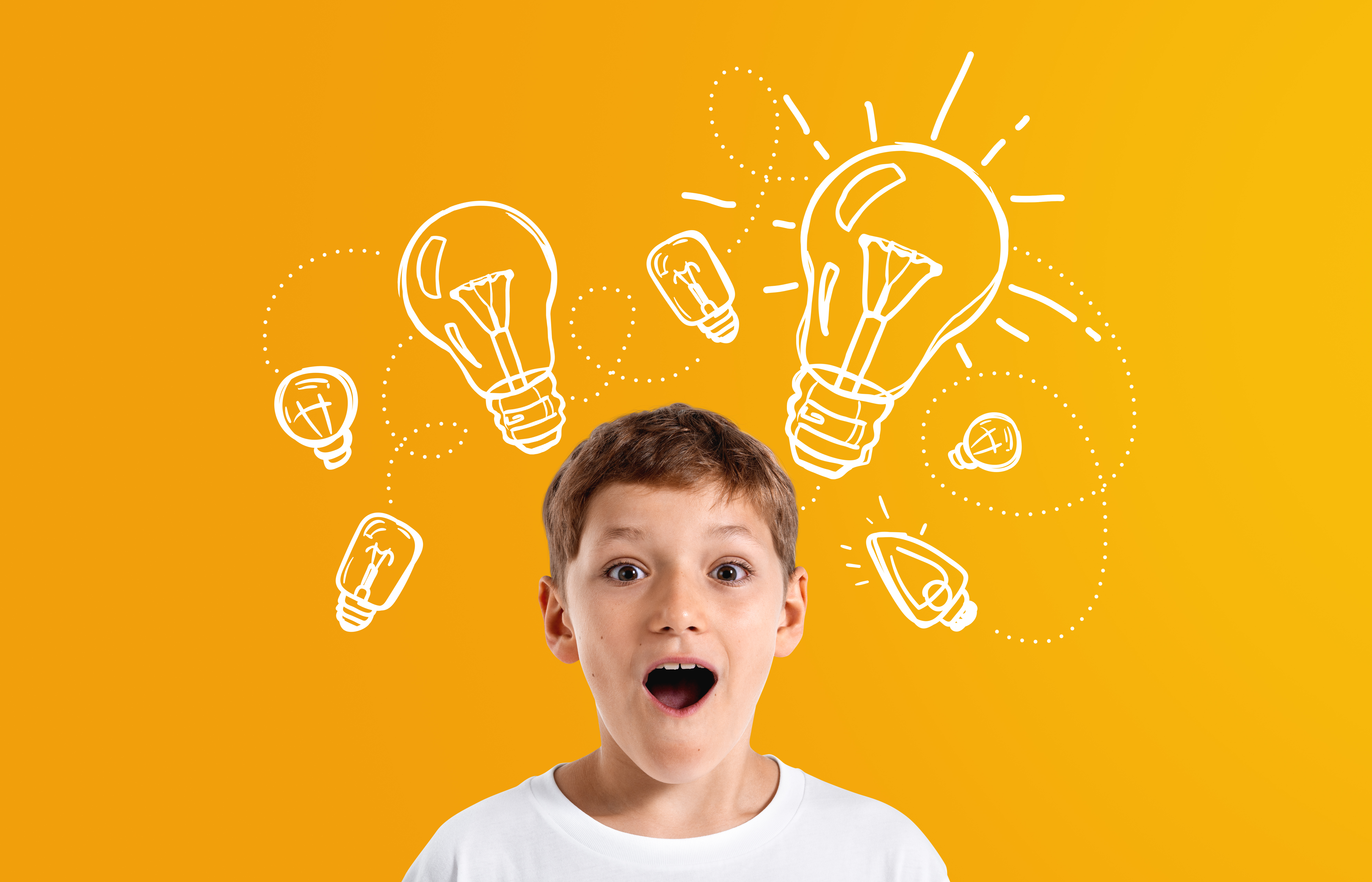 Excited boy with amazed expression, surrounded by white lightbulb sketches, on a bright orange background, representing creativity and inspiration