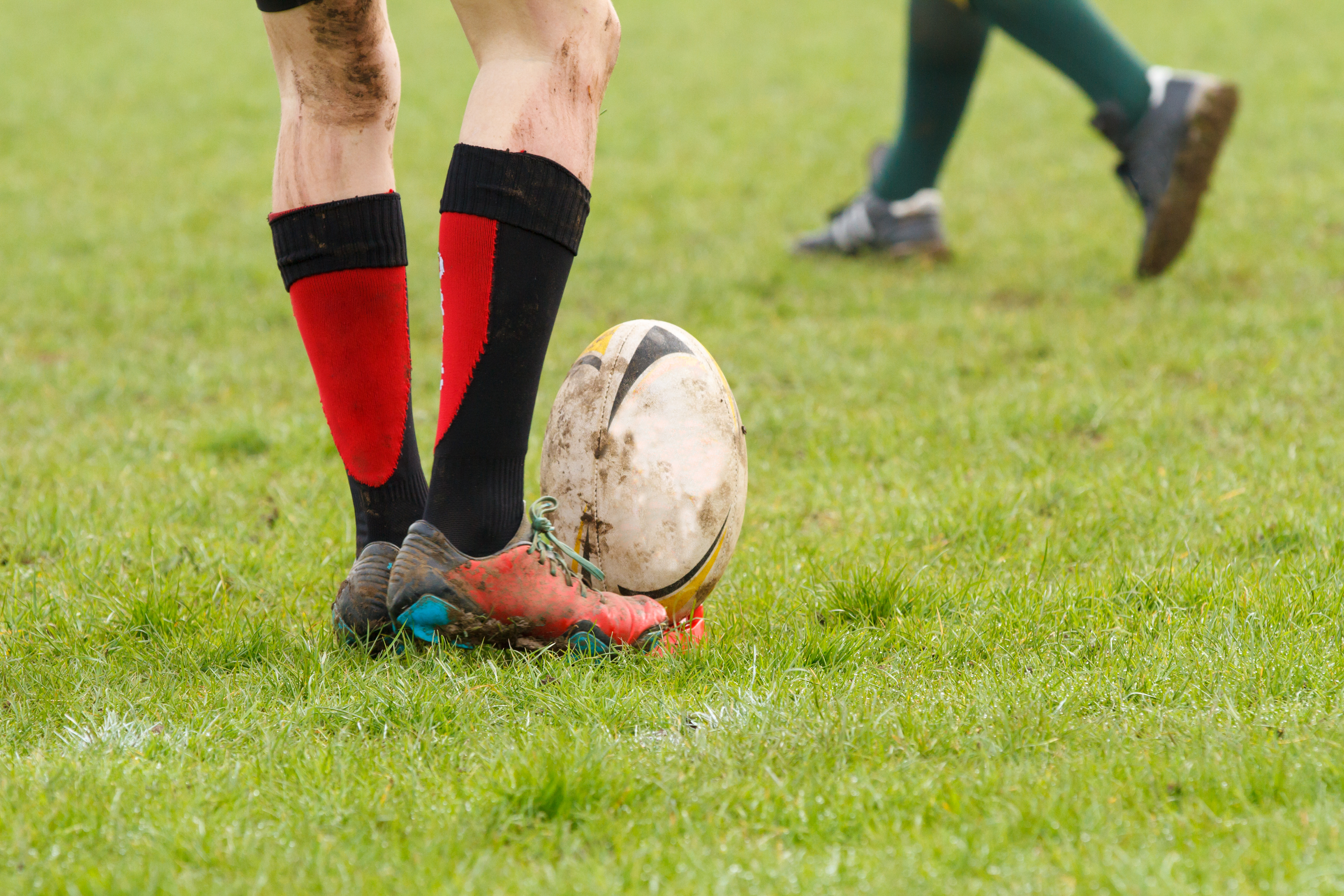 rugbybal rust op een voet 