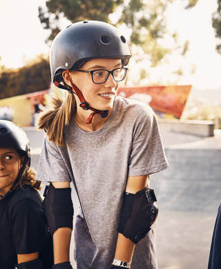 Shot of a group of young girls skateboarding together at a skatepark