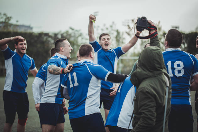 Team of rugby players playing a game at the stadium.
