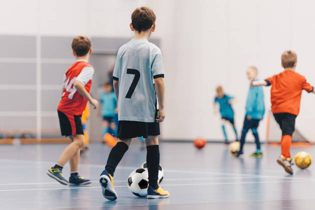 Futsal Boys in Training Game. Kids Play Indoor Soccer Practice Match. School Children Have Fun in Physical Education Class