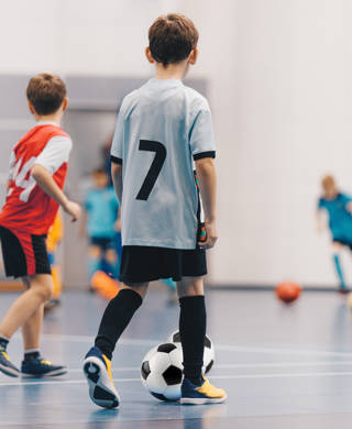 Futsal Boys in Training Game. Kids Play Indoor Soccer Practice Match. School Children Have Fun in Physical Education Class