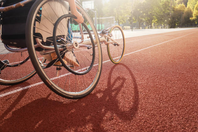 Athletic stadium track and a race wheelchair on it.